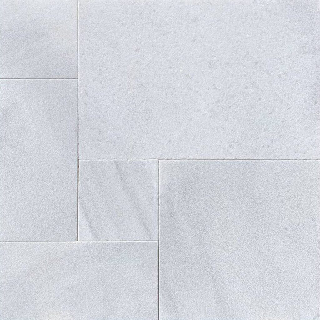 A piece of White Marble French Pattern paver tile